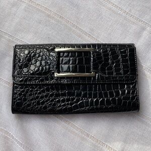 Candie’s animal print clutch with purple interior.